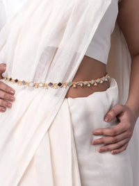 Model wearing Prerna Mirror Bridal Belt featuring geometric mirror motifs, faux pearl accents and handcrafted gold-tone detailing styled with a white saree.