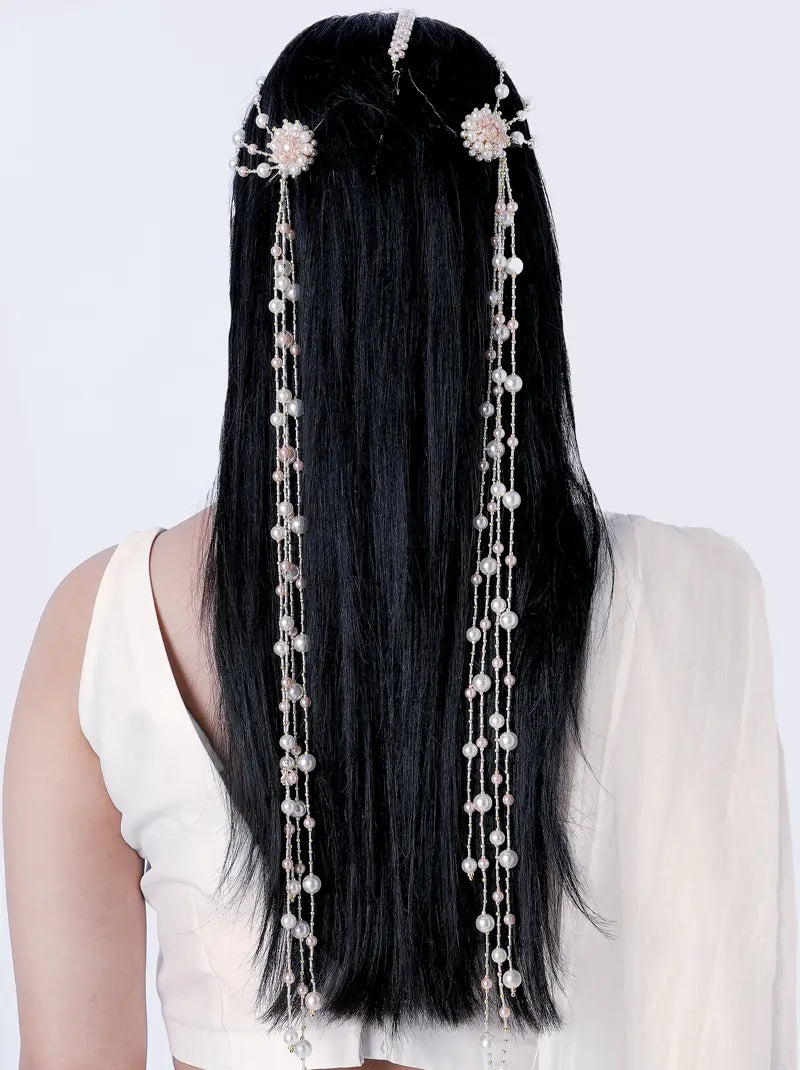 Rivaya Pearl Hair Accessory handcrafted with faux pearls, blush pearl accents, floral detailing and gold tone finish for bridal and festive hairstyles.