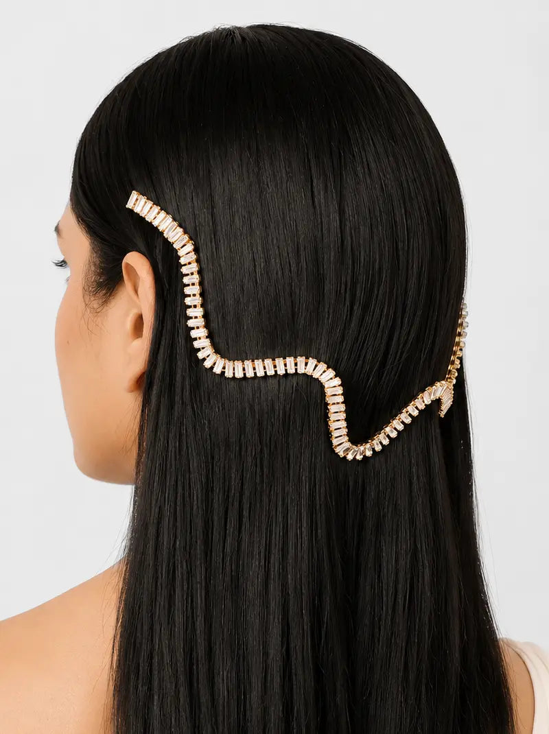 Ria Crystal Wave Hairvine handcrafted with baguette crystals and a gold tone finish, featuring an elegant wave design for bridal and festive hairstyles.