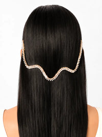 Ria Crystal Wave Hairvine handcrafted with baguette crystals and a gold tone finish, featuring an elegant wave design for bridal and festive hairstyles.