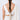 Model wearing Sana Floral Bridal Parandi featuring handcrafted floral tassels, faux pearls, fabric petals and gold-tone detailing styled on a long bridal braid.