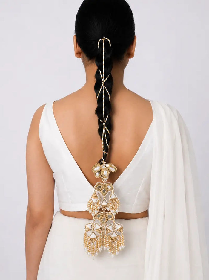Shanta Traditional Hair Parandi handcrafted with mirror motifs, faux pearls, intricate beadwork and elegant tassel detailing in a Gold Tone Finish, designed for bridal braids, weddings and festive occasions.