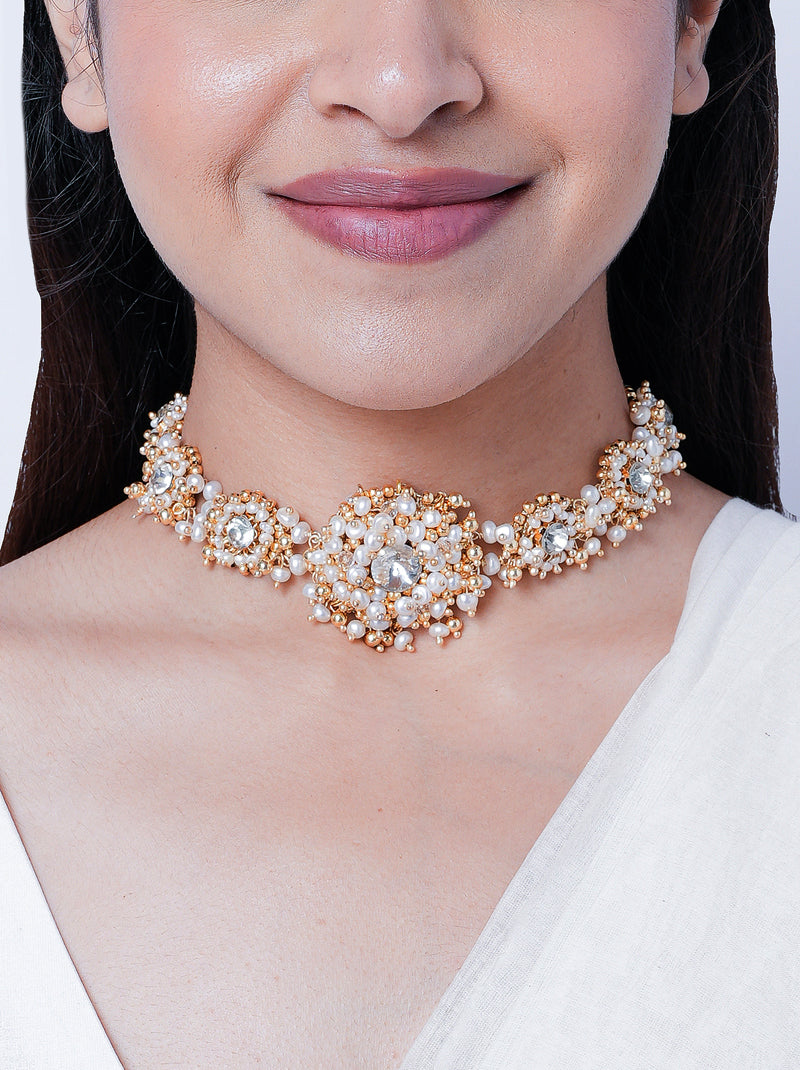 Vaidehi Handcrafted Beaded Choker featuring crystal stones, faux pearls, shell accents and intricate bead embroidery with a gold tone finish.